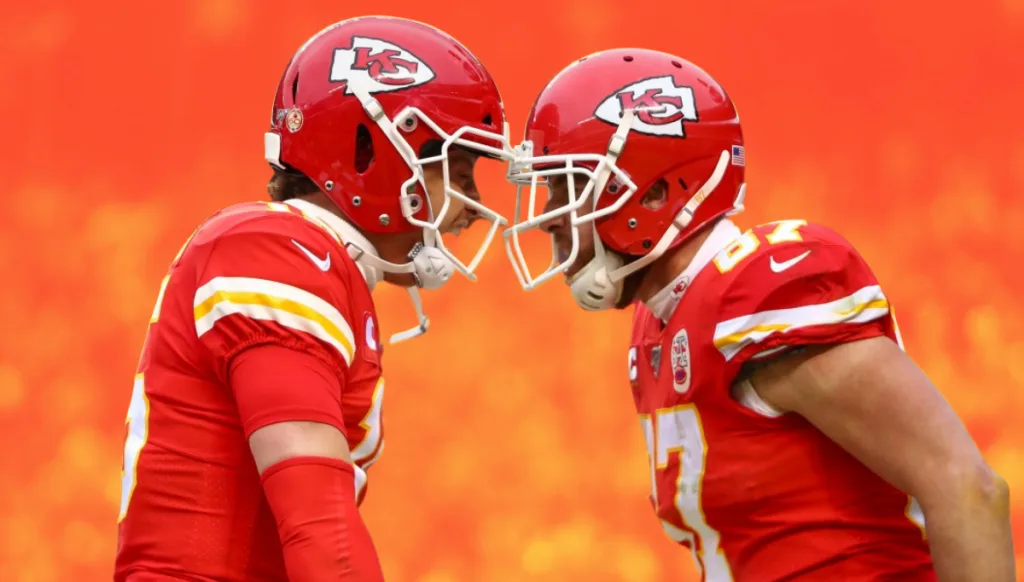 Two Kansas City Chiefs players touching helmets