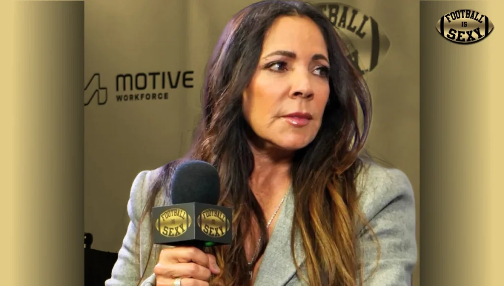 Female presenter holding microphone at interview