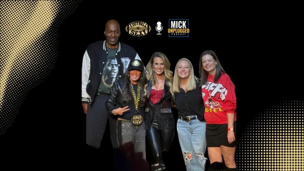 Five people posing on podcast stage